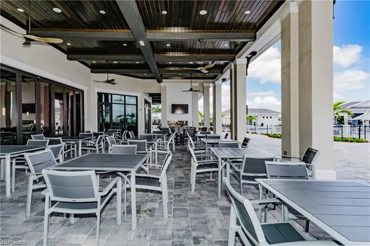 View of patio / terrace with ceiling fan and outdoor dining area
