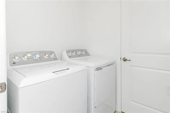 Laundry room with washing machine and dryer