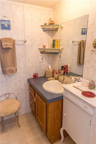 Half bath with vanity and ornamental molding