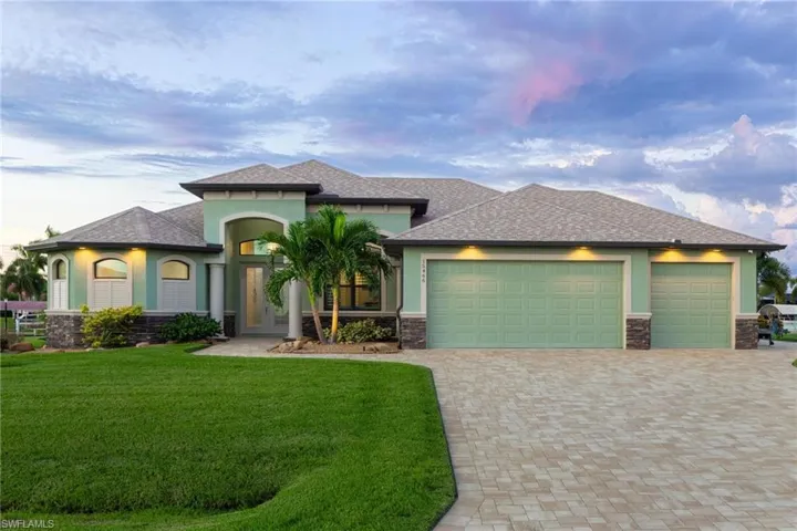 2021 built custom home with Gulf access, paver driveway, and 3 car garage.