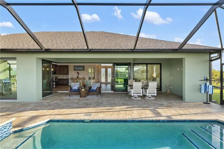 Back of property featuring a patio area and a lanai