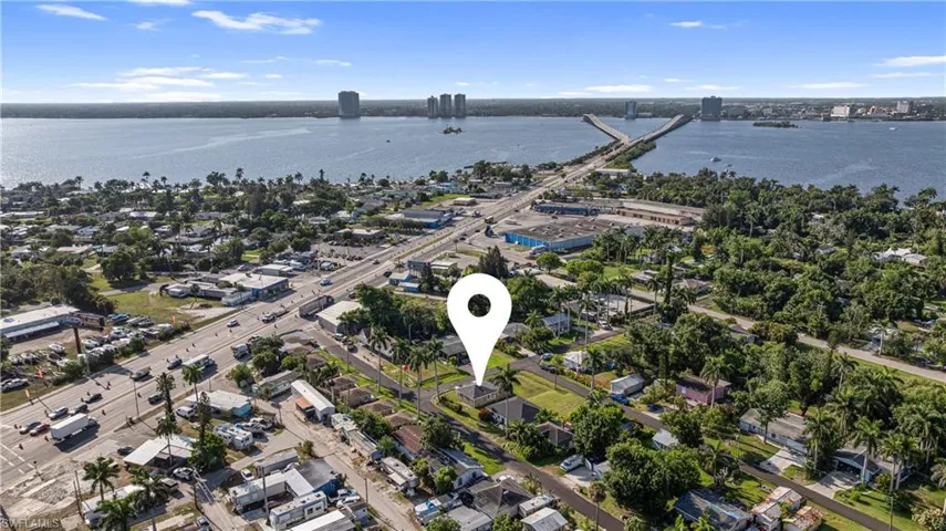 Aerial view of property's location with a notable bridge and a nearby body of water