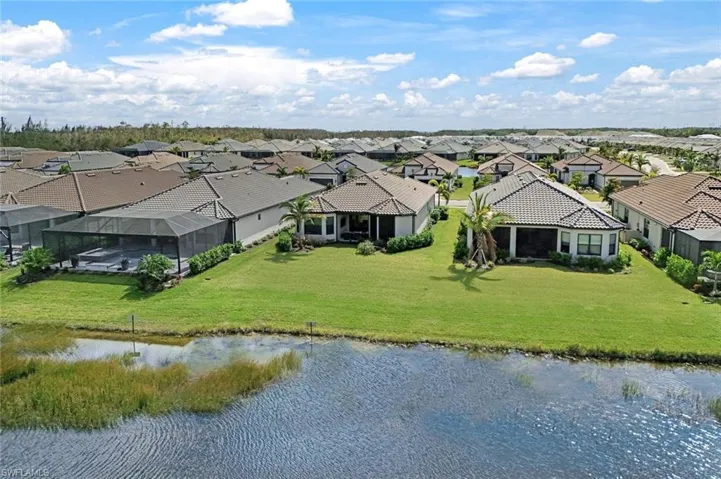 Aerial view featuring a residential view and a water view