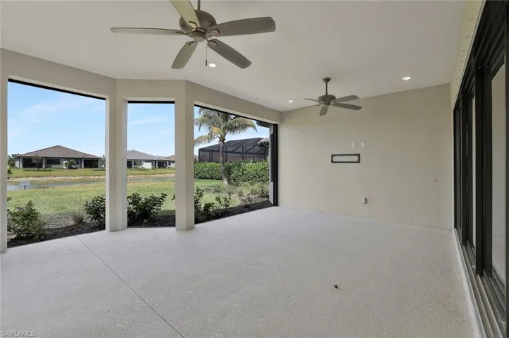 Unfurnished sunroom with a water view