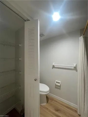 The bathroom has a linen closet