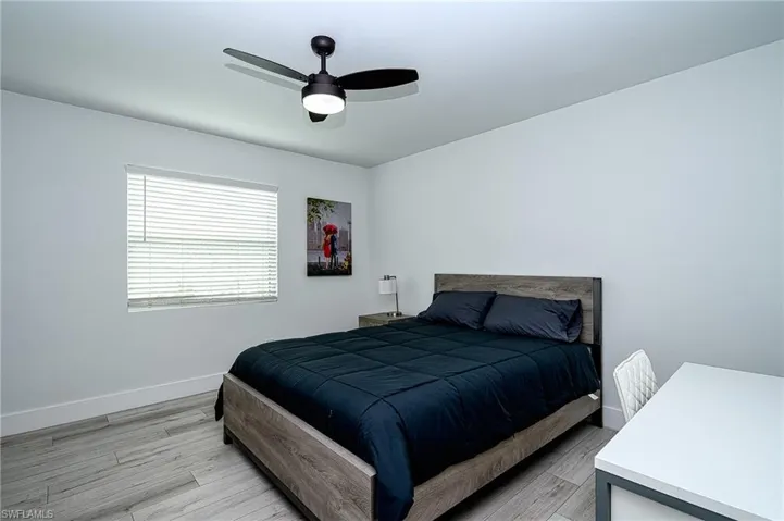 2nd Bedroom wood-type flooring and ceiling fan