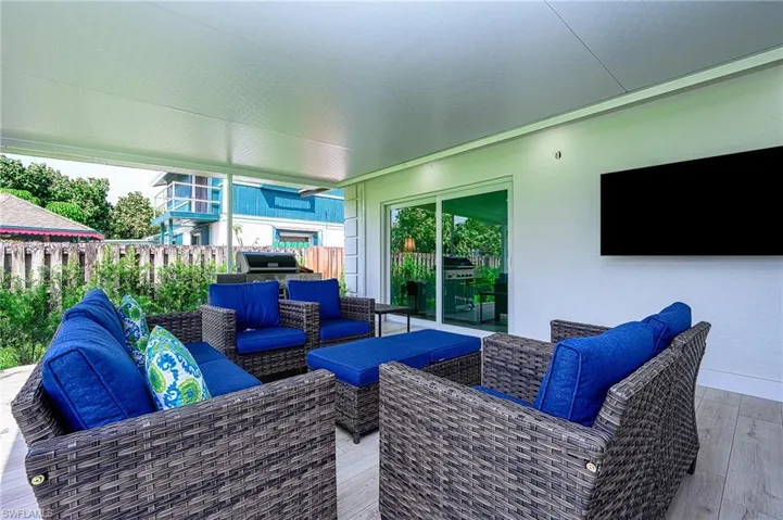 walk out to a huge sitting, dining area the outside screen enclosed  lanai entertainment area