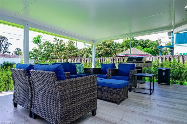 Wooden terrace featuring an outdoor hangout area