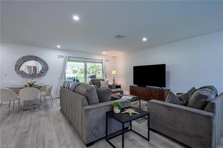 Living room with light hardwood / wood-style flooring