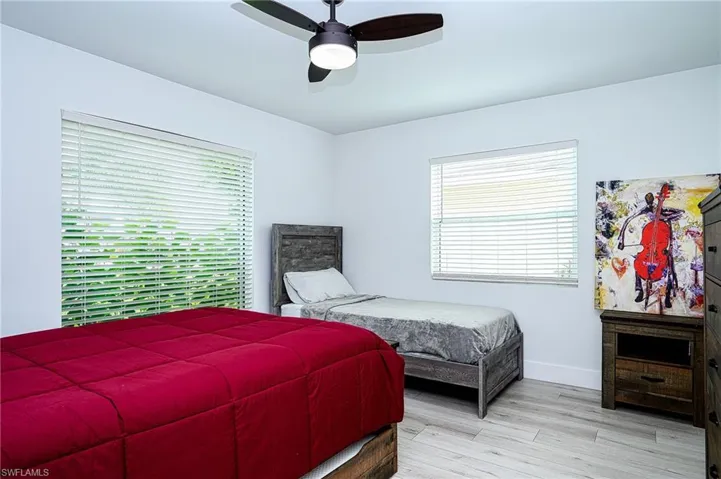 Large 3rd Bedroom featuring light hardwood / wood-style flooring and ceiling fan