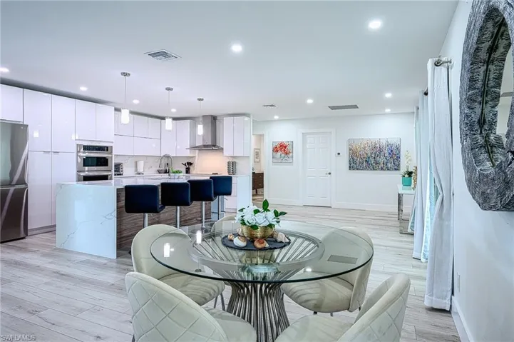 Dining space featuring light hardwood / wood-style floors and sink