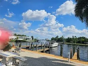 Dock area with a water view and a boat ramp