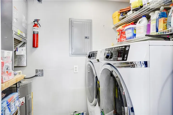 Laundry room with newer washer/dryer.