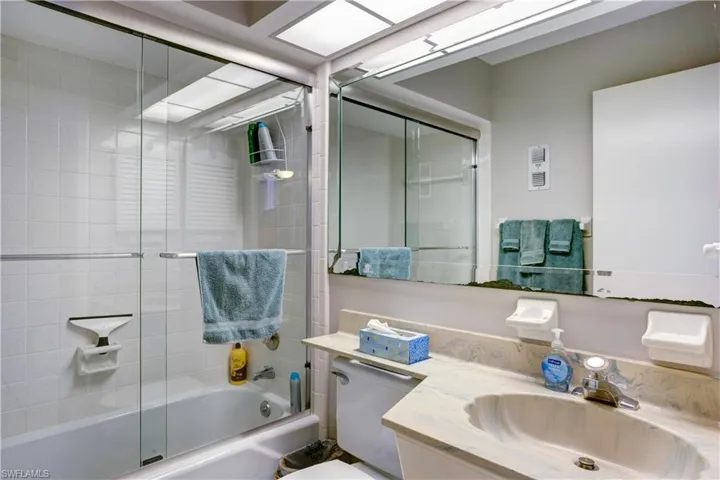 Guest bathroom next to guest room, shower/tub combination, new shower doors.