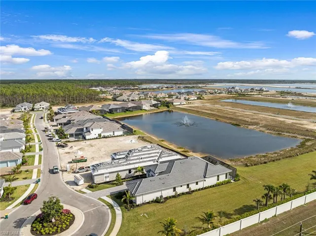 Aerial perspective of suburban area with a nearby body of water