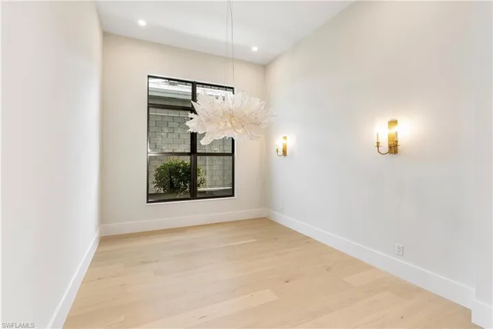 Unfurnished room featuring light wood finished floors and recessed lighting