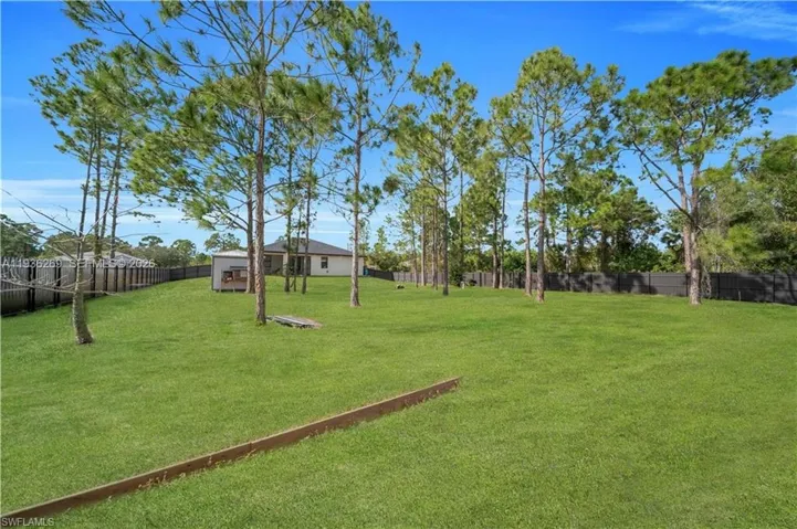View of fenced backyard