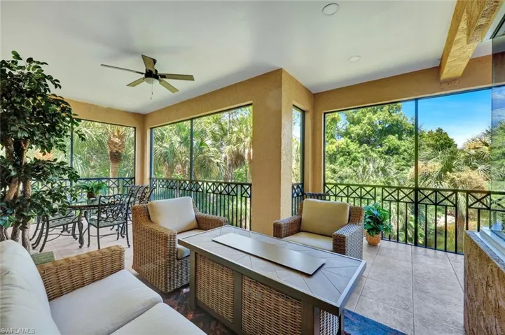 Sunroom / solarium with an outdoor hangout area and a ceiling fan