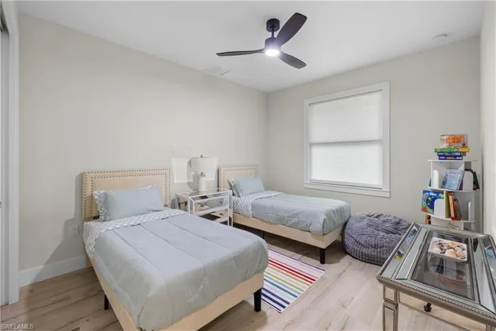 Light-filled room featuring light wood-finish flooring and neutral wall tones