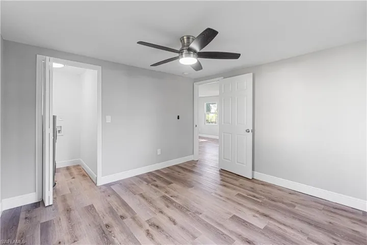 Spare room with ceiling fan and light hardwood / wood-style flooring