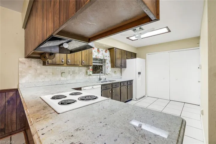 Spacious kitchen with ample cabinetry and granite counter tops