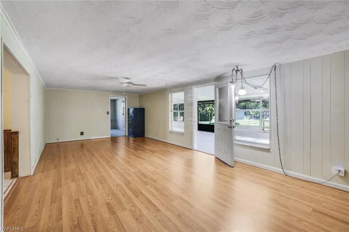 Other side of the family room with door to a fourth bedroom