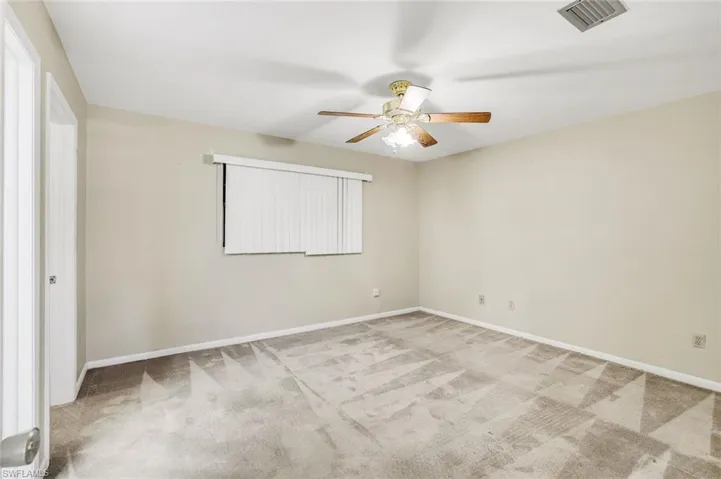 Master bedroom with adjoining bath and walk-in closet