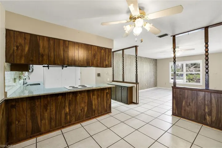 Floor plan has an easy flow among front living room, dining area and kitchen