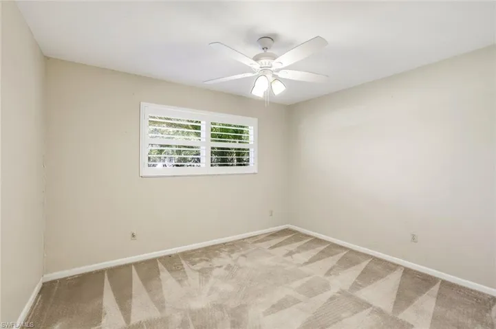 Third bedroom with window overlooking front yard