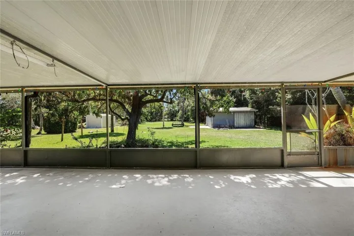 Large, screened-in lanai spanning the length of the home