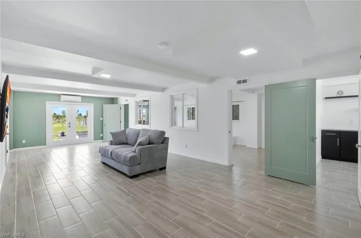 lower level living area with doors leading out to the garden