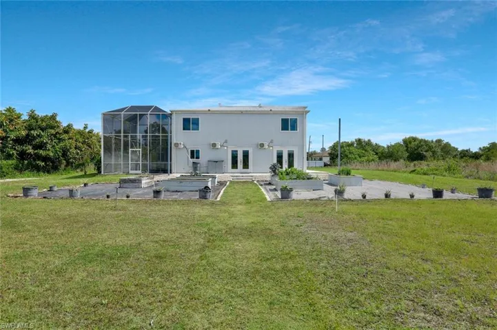 Rear of home with vegetable growing area