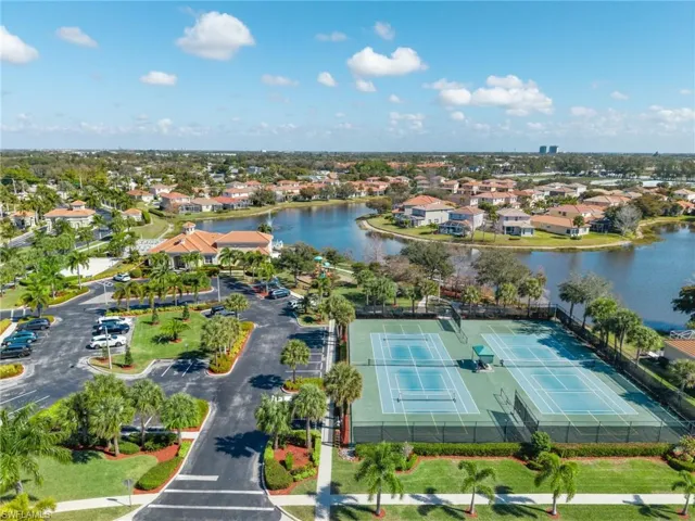 Aerial view of residential area featuring a large body of water