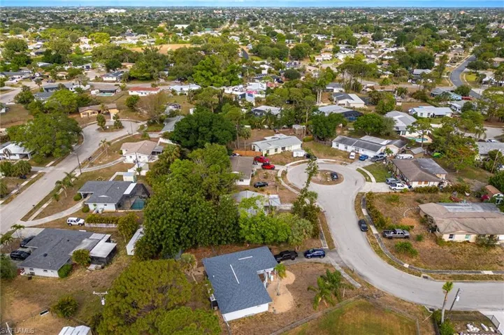 Aerial view of property's location featuring nearby suburban area