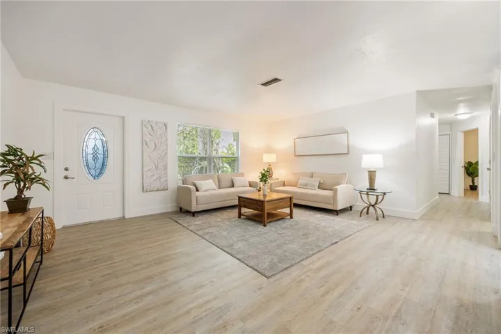Living room featuring wood finished floors and baseboards