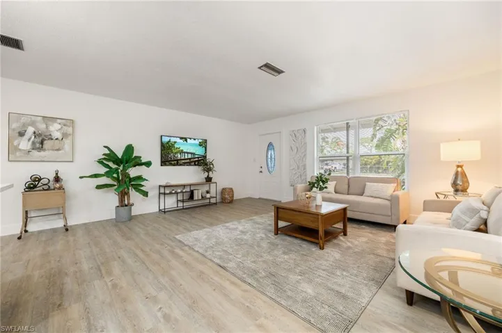 Living room featuring light wood finished floors and baseboards