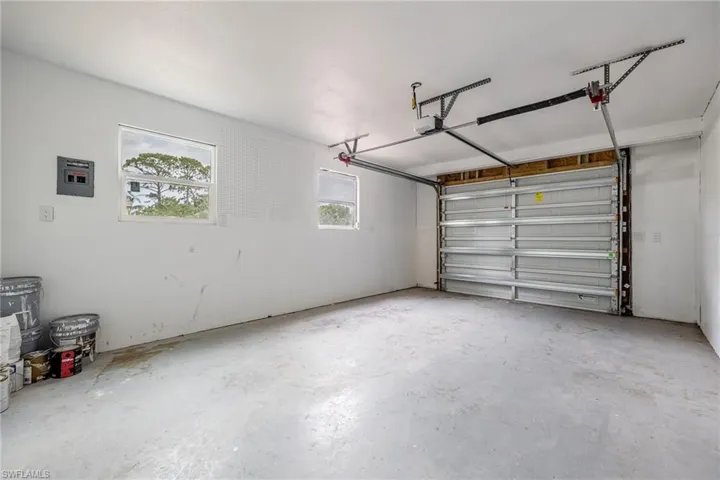Garage featuring a garage door opener