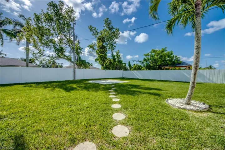 View of fenced backyard