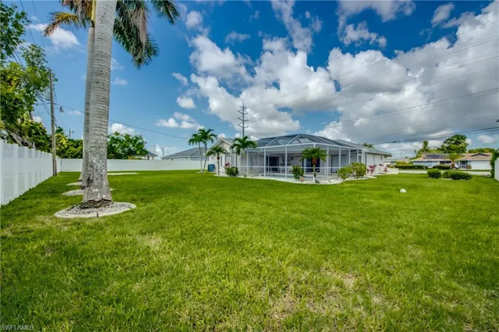 View of yard with a lanai
