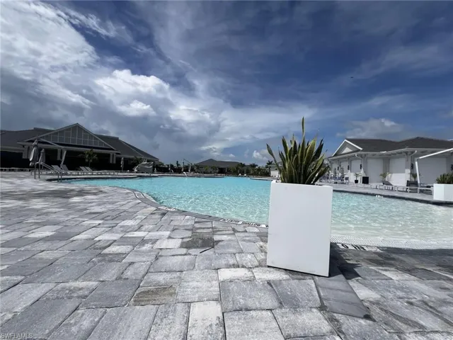 Community pool featuring a patio area