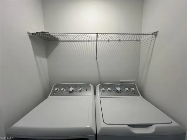 Washroom featuring washer and dryer