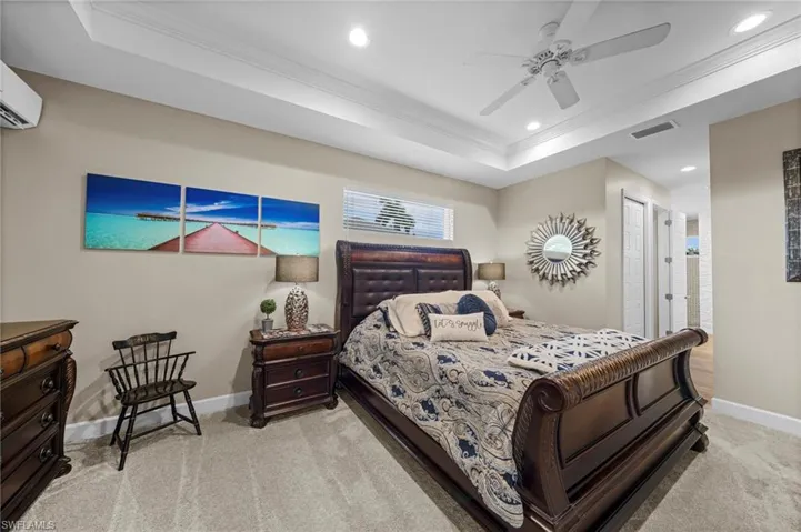 Full bathroom with walk in shower, recessed lighting, two vanities, and wood finished floors