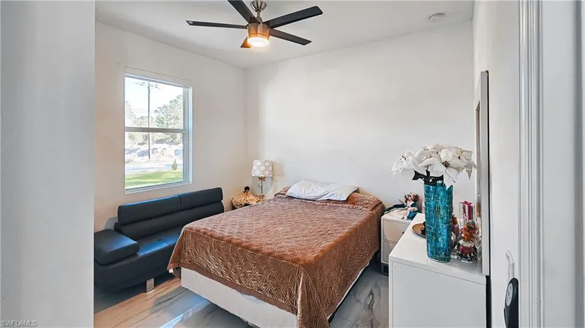 Bedroom featuring a ceiling fan