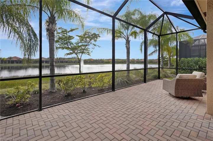 Unfurnished sunroom featuring a water view