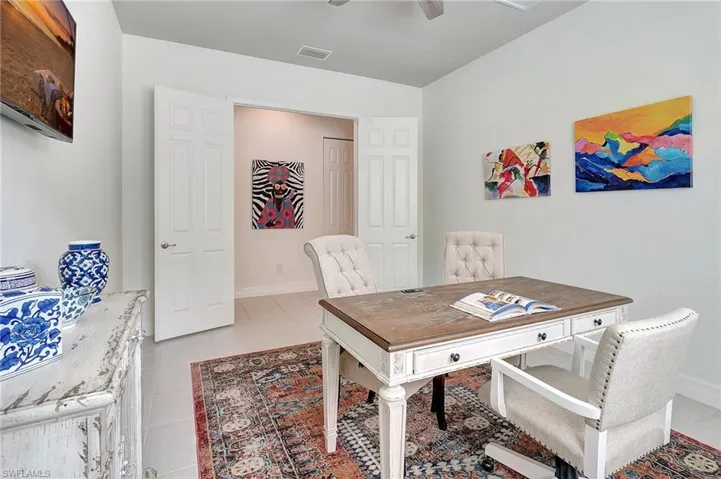 Office space with ceiling fan and light tile patterned floors