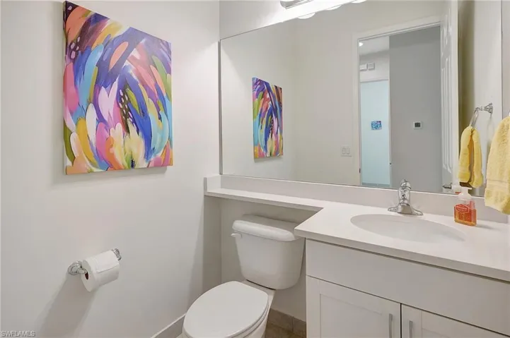 Bathroom featuring vanity and toilet