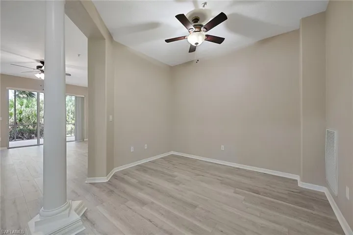 Study featuring ceiling fan and luxury vinyl Floor