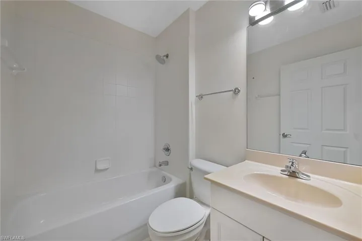 Bathroom featuring vanity and shower/tub  combination