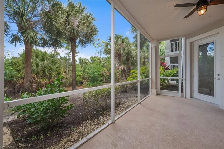 Covered screened lanai with light/ ceiling fan and sliding doors