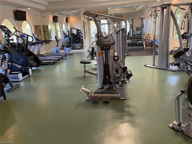 Exercise room with cardio and strength training equipment